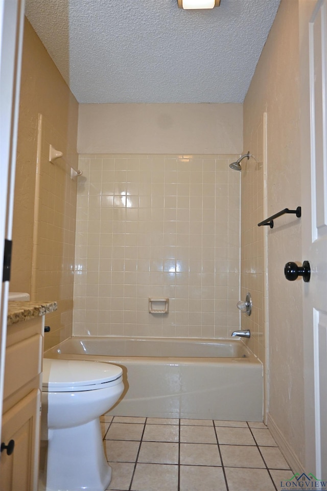 811 Georgia Ln, Longview, TX 75604 - bathroom with tile patterned flooring, tub / shower combination, a textured ceiling, and vanity