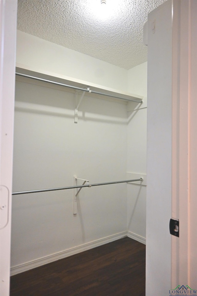 811 Georgia Ln, Longview, TX 75604 - walk in closet with dark wood finished floors