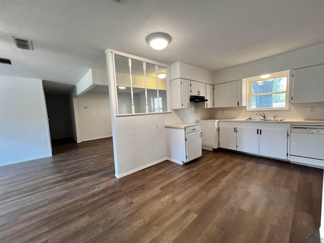 kitchen featuring dishwasher, dark hardwood / wood-style flooring, white cabinetry, and sink