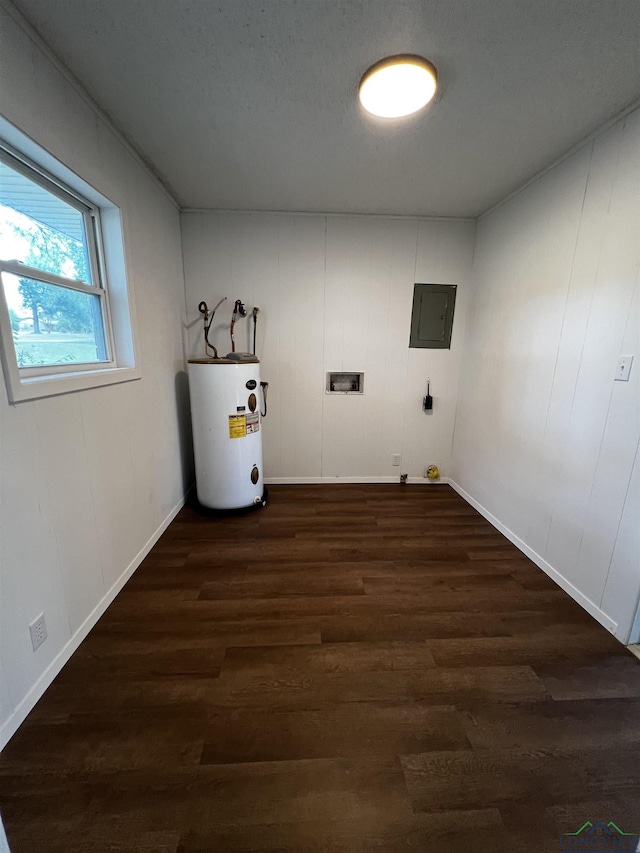 laundry room featuring dark wood-type flooring, electric panel, hookup for a washing machine, a textured ceiling, and water heater