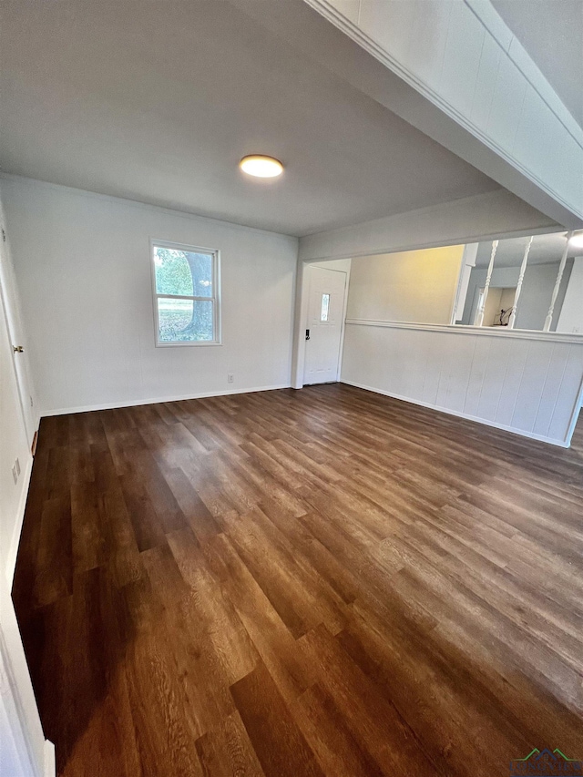 empty room featuring dark wood-type flooring