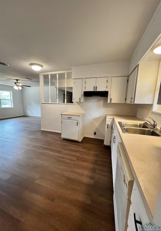 kitchen featuring ceiling fan, dark wood-type flooring, sink, dishwasher, and white cabinetry