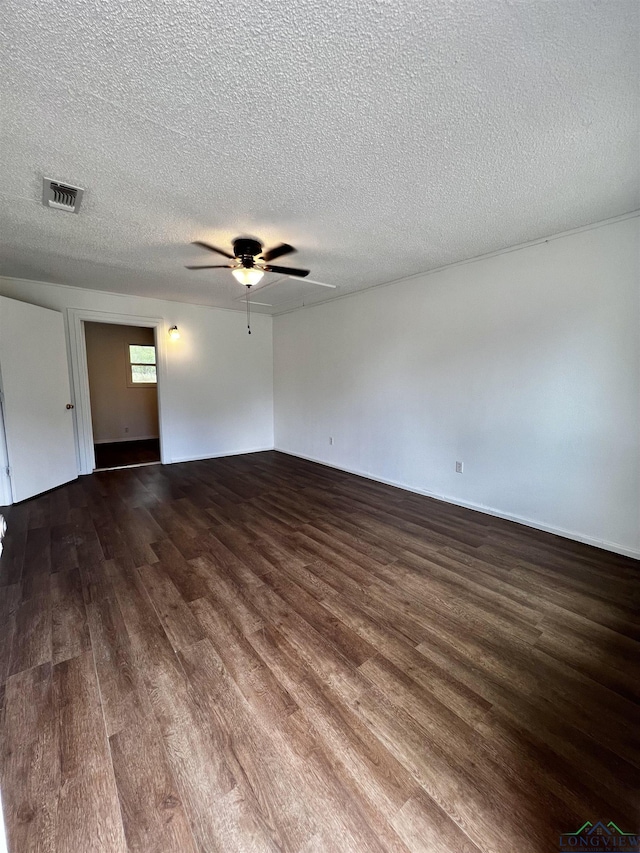 spare room featuring ceiling fan, hardwood / wood-style floors, and a textured ceiling