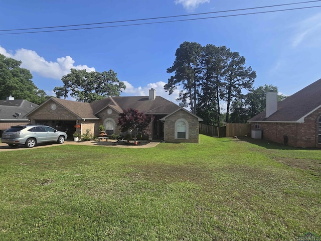 704 Cheryl St, Longview, TX 75604 - view of front of property with driveway, a chimney, a front yard, fence, and an attached garage