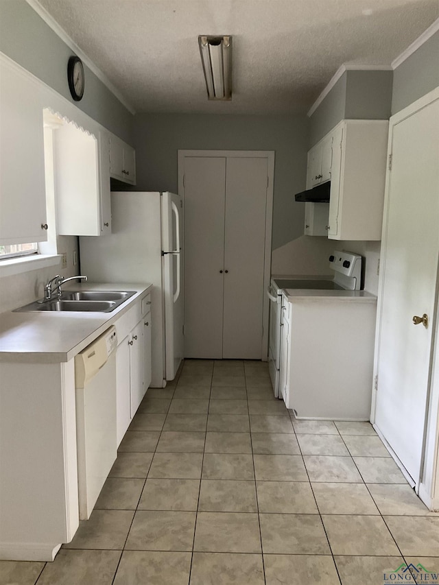 kitchen with white cabinets, a textured ceiling, white appliances, and sink