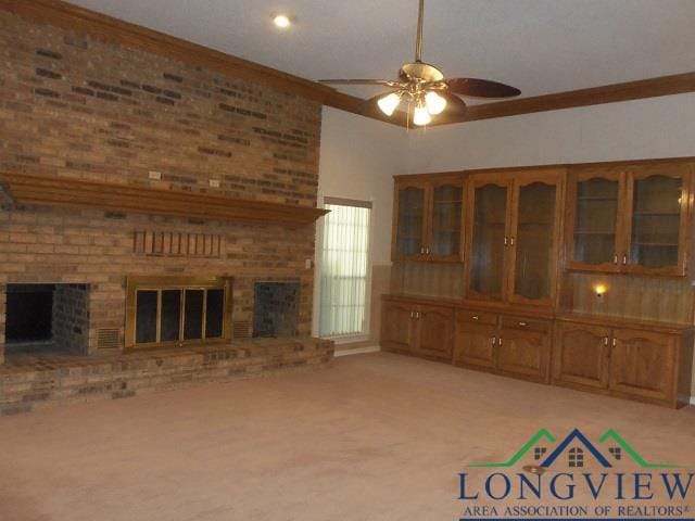 404 Moccasin Trl, Kilgore, TX 75662 - unfurnished living room with a fireplace, a ceiling fan, carpet, and crown molding