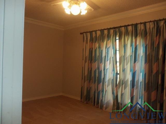 404 Moccasin Trl, Kilgore, TX 75662 - spare room featuring ceiling fan, ornamental molding, baseboards, and wood finished floors
