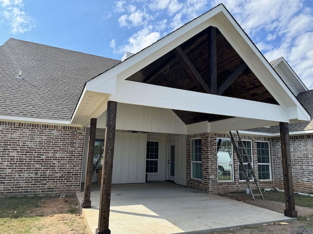 back of property featuring a carport