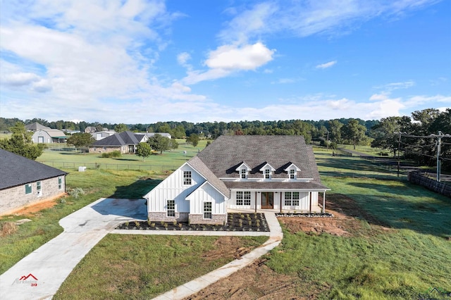 view of front of home featuring a porch and a front lawn