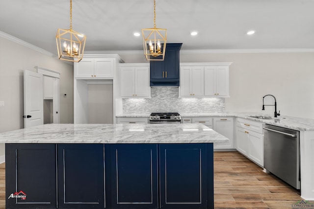 kitchen with pendant lighting, a notable chandelier, sink, and appliances with stainless steel finishes