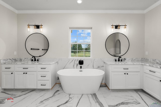 bathroom with a bath, vanity, and crown molding