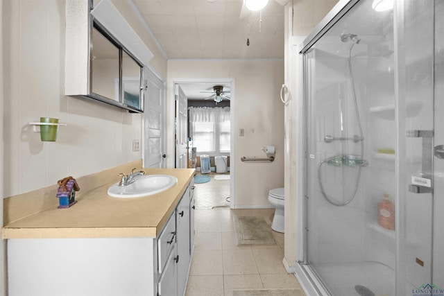 bathroom featuring vanity, an enclosed shower, ceiling fan, and toilet