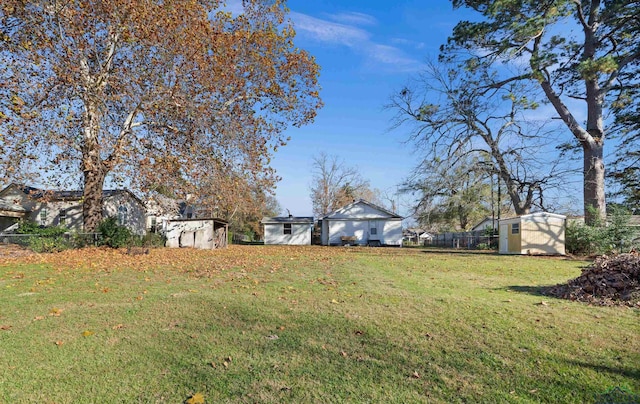 view of yard featuring a storage unit