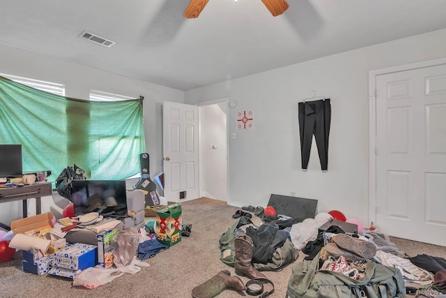 bedroom with carpet floors, visible vents, and ceiling fan