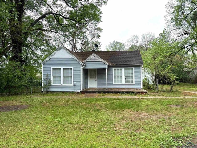 308 E 14th St, Mount Pleasant, TX 75455 - bungalow with covered porch, fence, and a front yard