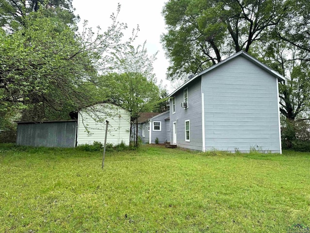308 E 14th St, Mount Pleasant, TX 75455 - view of side of property featuring a lawn
