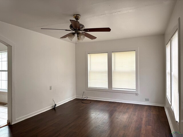 308 E 14th St, Mount Pleasant, TX 75455 - unfurnished room with a ceiling fan, arched walkways, dark wood-style floors, and baseboards