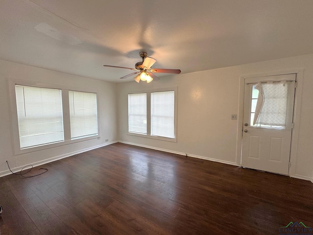 308 E 14th St, Mount Pleasant, TX 75455 - foyer entrance featuring baseboards, ceiling fan, and dark wood-style flooring