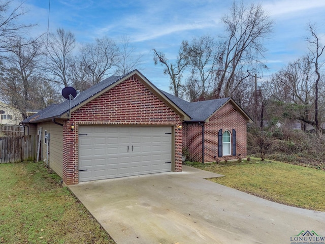 ranch-style home featuring a garage, a front yard, concrete driveway, and brick siding