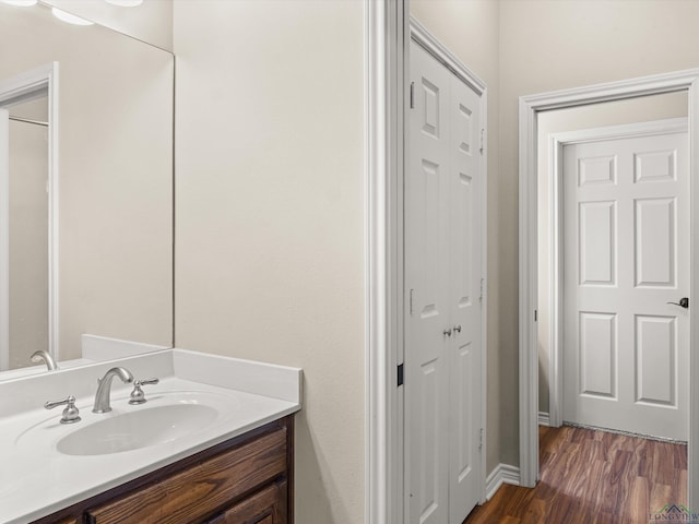 bathroom featuring vanity and hardwood / wood-style flooring