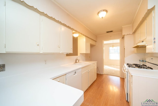 kitchen featuring white cabinets, white appliances, light hardwood / wood-style flooring, and sink