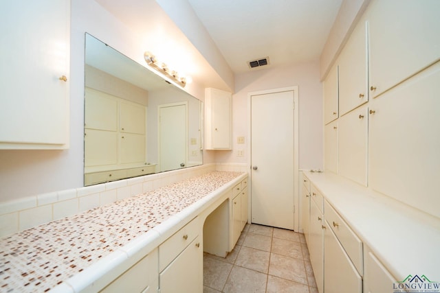 bathroom with tile patterned floors