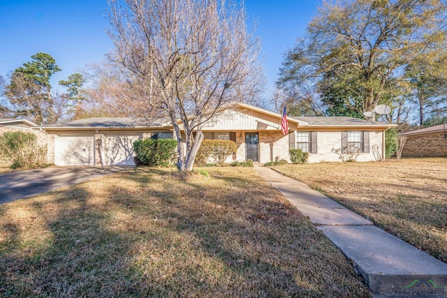 ranch-style home featuring a front yard and a garage