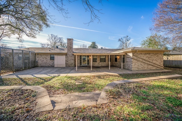 rear view of house with a patio