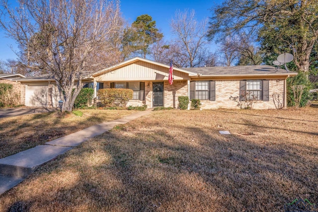 single story home with a porch, a garage, and a front lawn