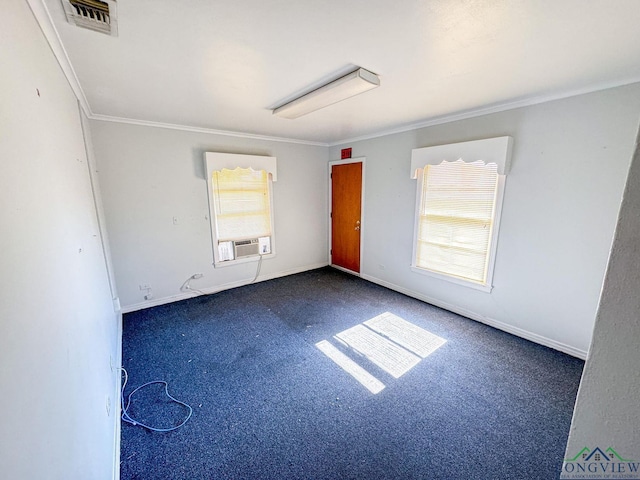 empty room featuring cooling unit and crown molding