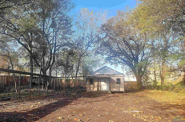 back of property featuring an outbuilding