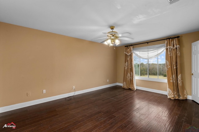 spare room with ceiling fan and dark wood-type flooring