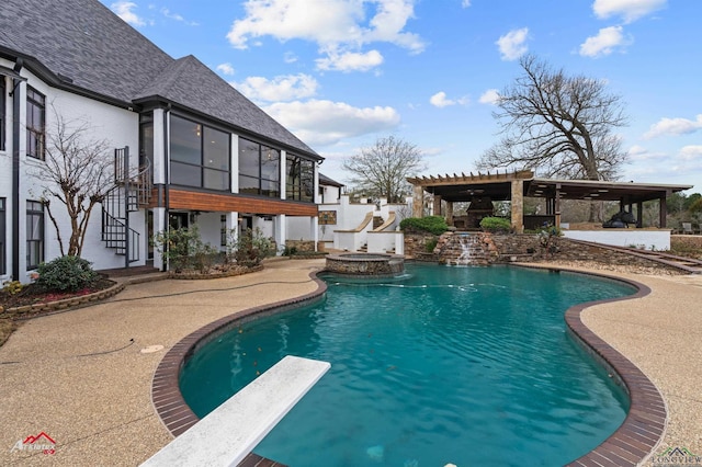 view of pool featuring a patio area, a diving board, a sunroom, and an in ground hot tub