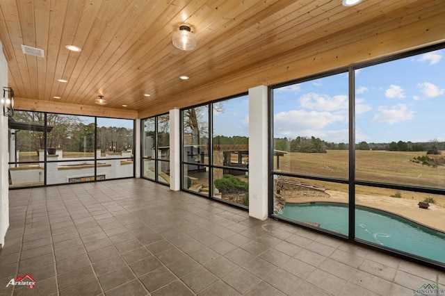 unfurnished sunroom with a wealth of natural light and wooden ceiling