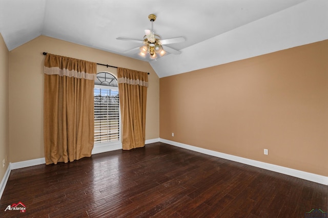 empty room with ceiling fan, dark hardwood / wood-style flooring, and lofted ceiling