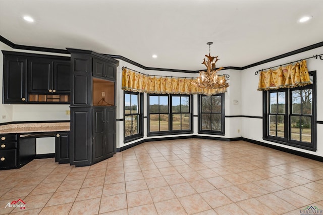 kitchen with light tile patterned floors, pendant lighting, and ornamental molding