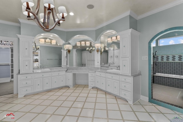 bathroom with vanity, crown molding, an inviting chandelier, and walk in shower