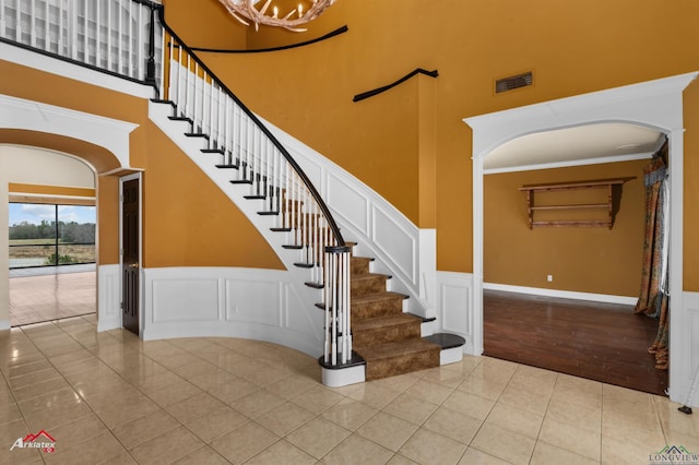 stairway with tile patterned floors