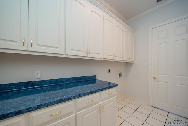 7 Summer Creek Way, Longview, TX 75604 - washroom with cabinet space, hookup for a washing machine, ornamental molding, hookup for an electric dryer, and light tile patterned flooring