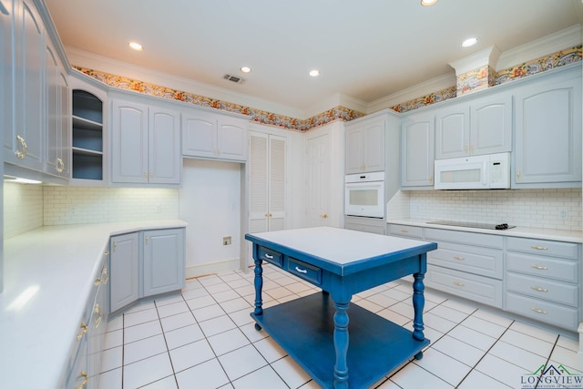 7 Summer Creek Way, Longview, TX 75604 - kitchen with white appliances, light countertops, crown molding, tasteful backsplash, and recessed lighting