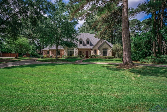 7 Summer Creek Way, Longview, TX 75604 - view of front of property featuring a front yard and stone siding