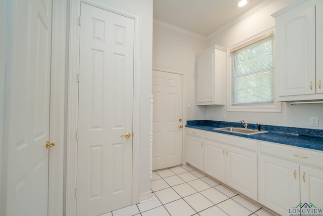 7 Summer Creek Way, Longview, TX 75604 - kitchen with dark countertops, ornamental molding, white cabinets, and light tile patterned floors