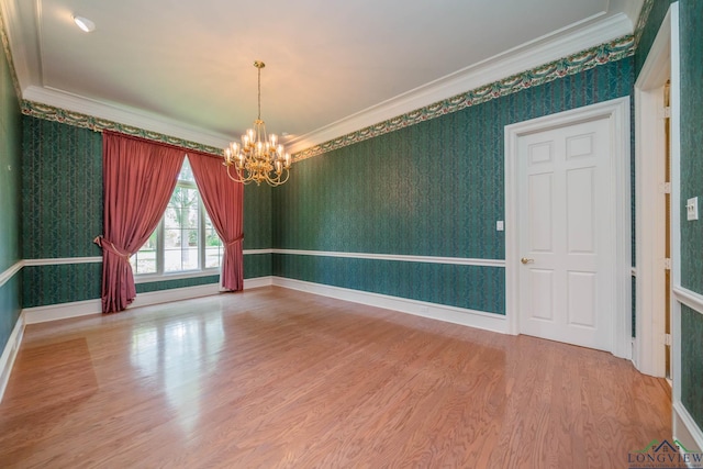 7 Summer Creek Way, Longview, TX 75604 - empty room with a chandelier, wallpapered walls, ornamental molding, and wood finished floors