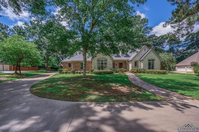 7 Summer Creek Way, Longview, TX 75604 - view of front of property featuring stone siding and a front yard