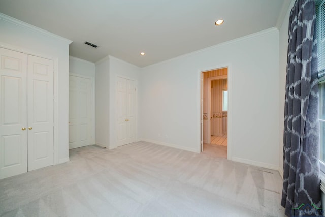7 Summer Creek Way, Longview, TX 75604 - unfurnished bedroom featuring light colored carpet, ornamental molding, recessed lighting, and two closets