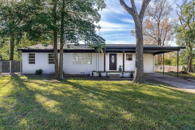 ranch-style home with a carport and a front yard