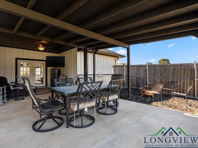 view of patio / terrace featuring ceiling fan and french doors