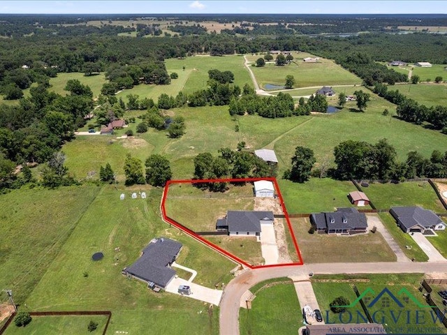 birds eye view of property featuring a rural view