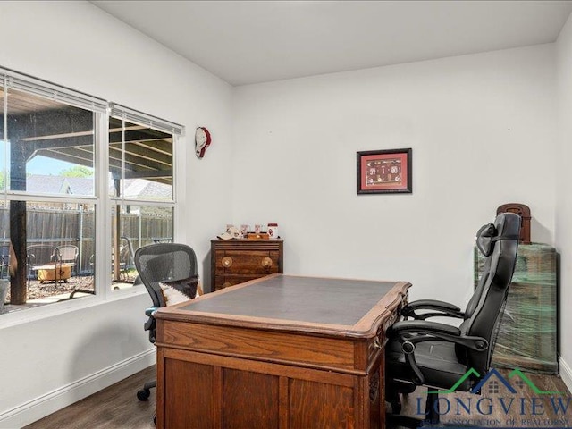 office with dark wood-type flooring