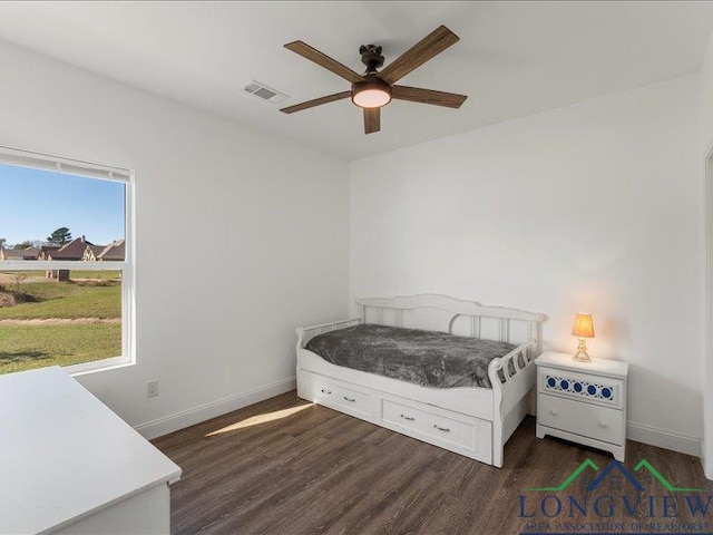 bedroom featuring ceiling fan and dark wood-type flooring